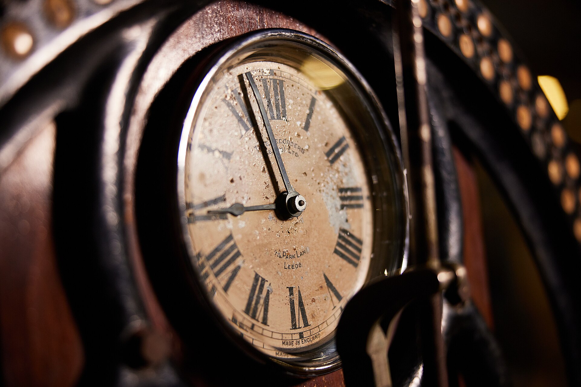 The face of an early factory clocking-in clock